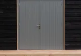Dubbele deur Meranti buitenmaat 202x221cm met RVS deurbeslag gegrond